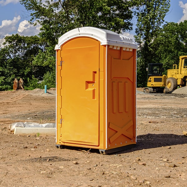 how often are the portable restrooms cleaned and serviced during a rental period in Wales